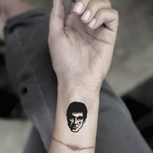 fake small tony montana portrait temporary tattoo sticker design idea on wrist