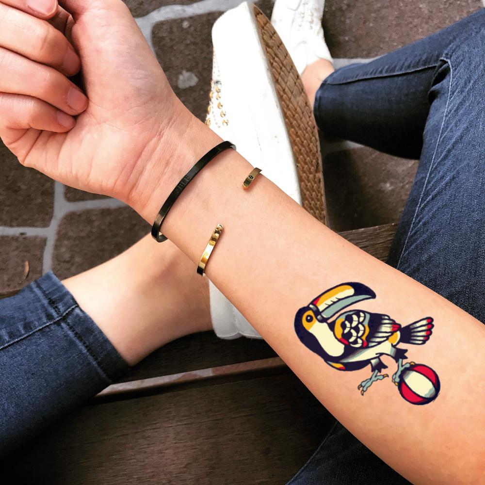 fake small toucan animal color temporary tattoo sticker design idea on forearm