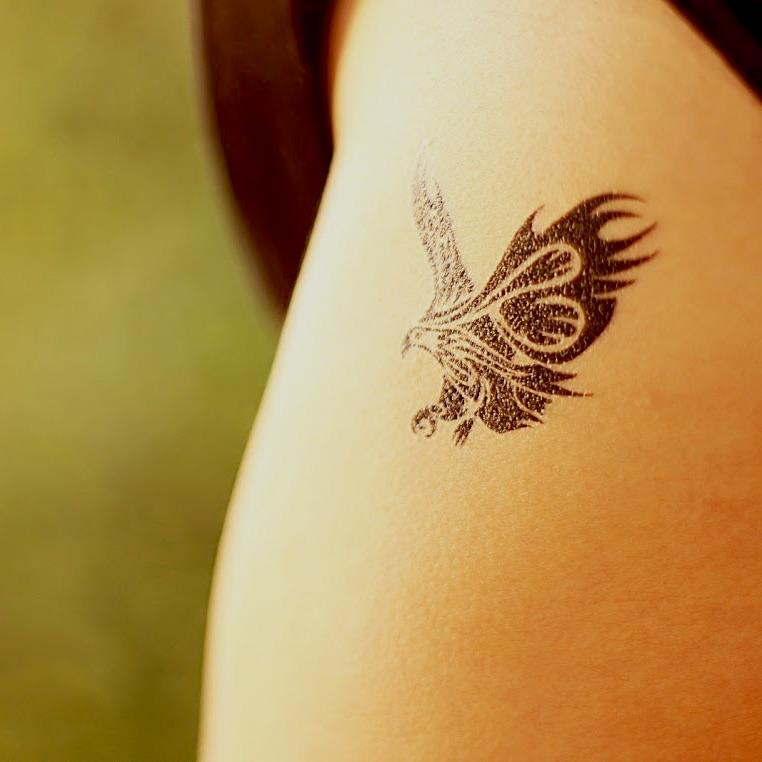 fake small tribal roman eagle animal temporary tattoo sticker design idea on upper arm