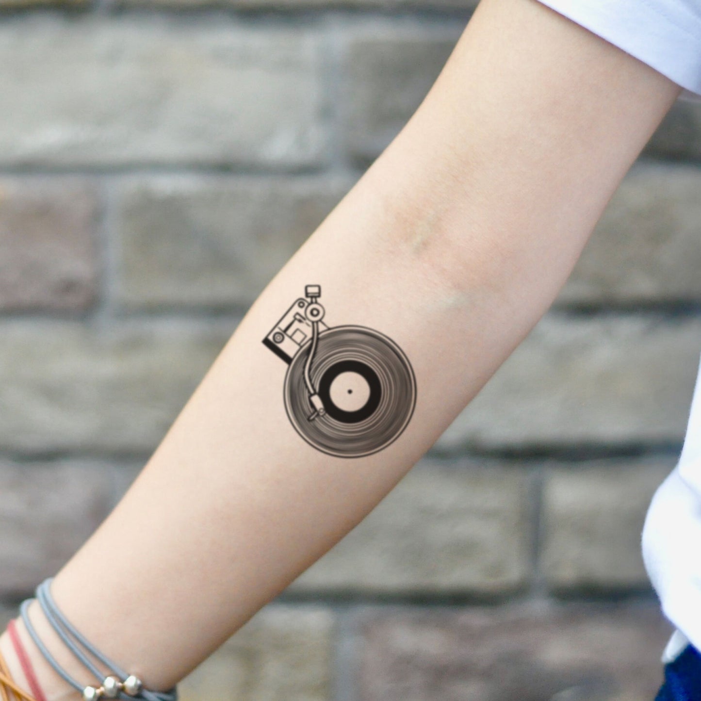 fake small turntable vinyl record player uncommon music temporary tattoo sticker design idea on inner arm