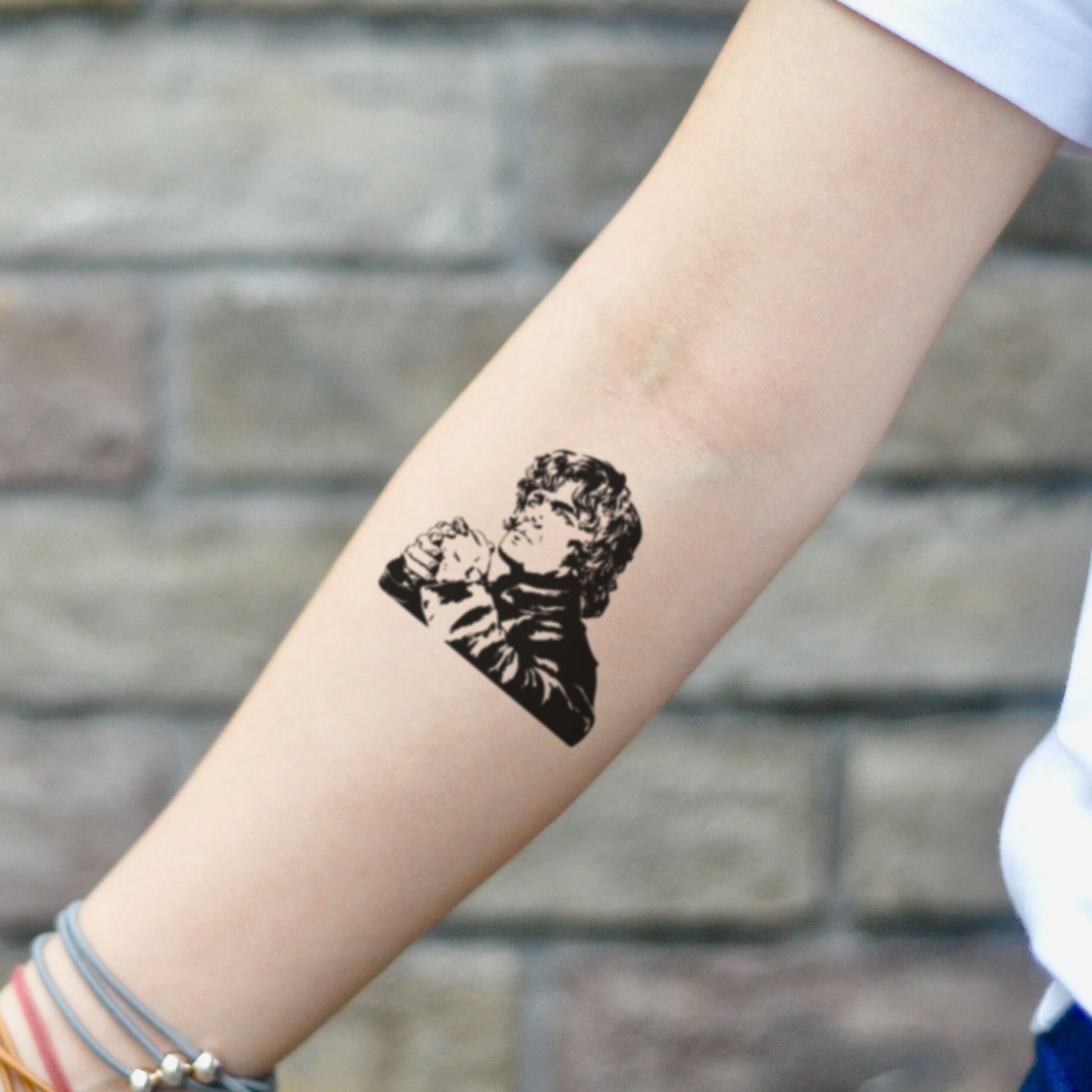 fake small tyrion lannister portrait temporary tattoo sticker design idea on inner arm