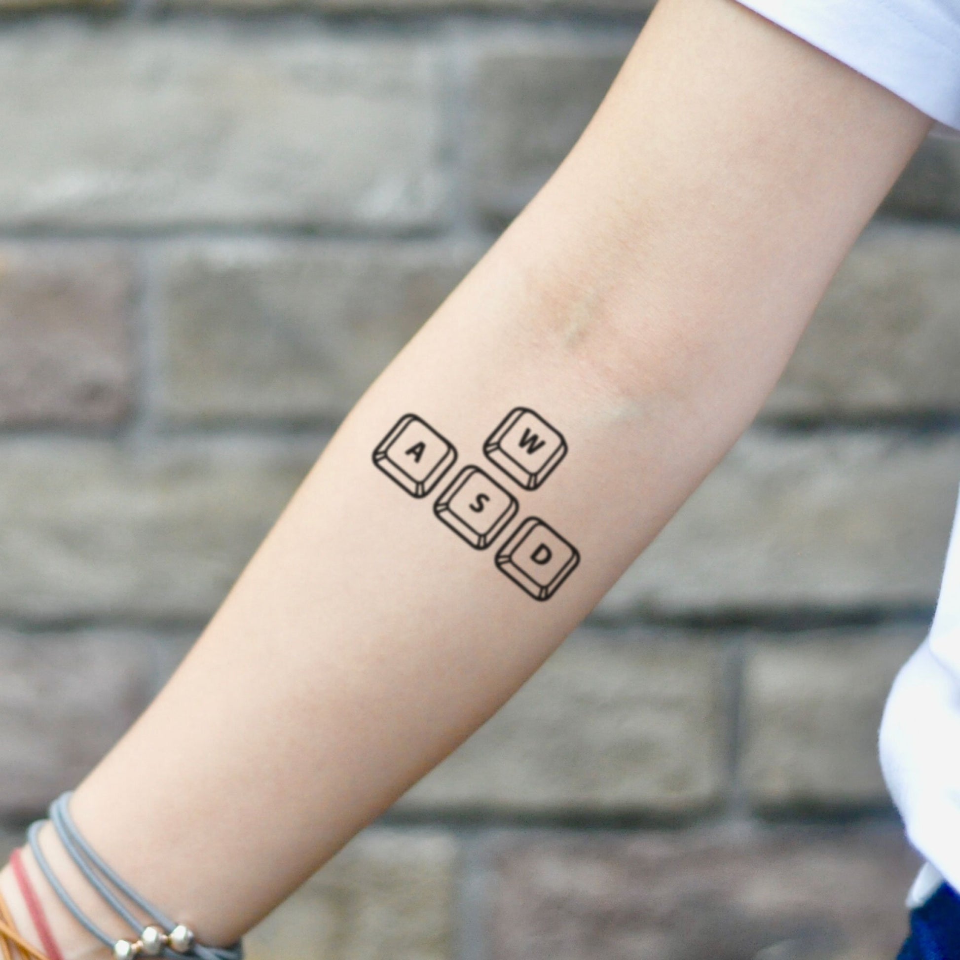 fake small wasd gaming keyboard keys lettering temporary tattoo sticker design idea on inner arm