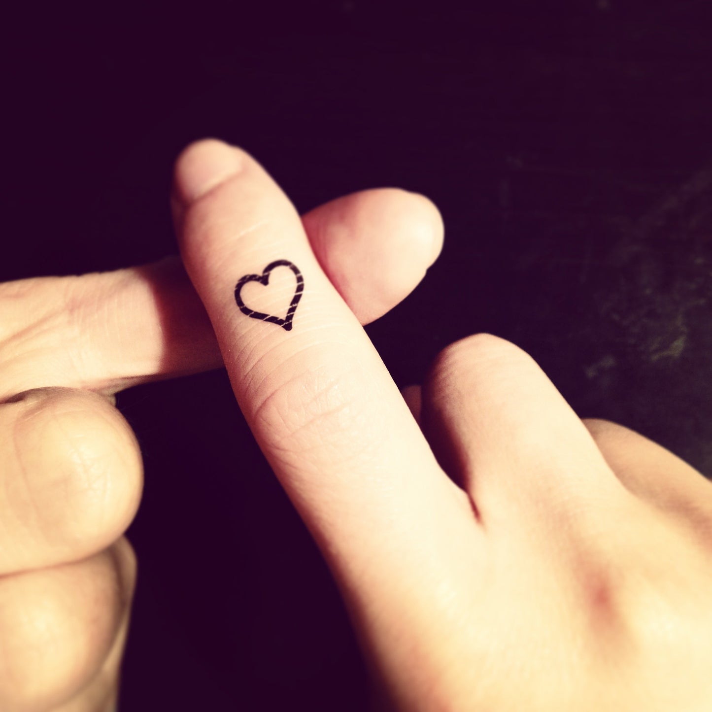 fake tiny small heart outline amanda bynes minimalist temporary tattoo sticker design idea on finger