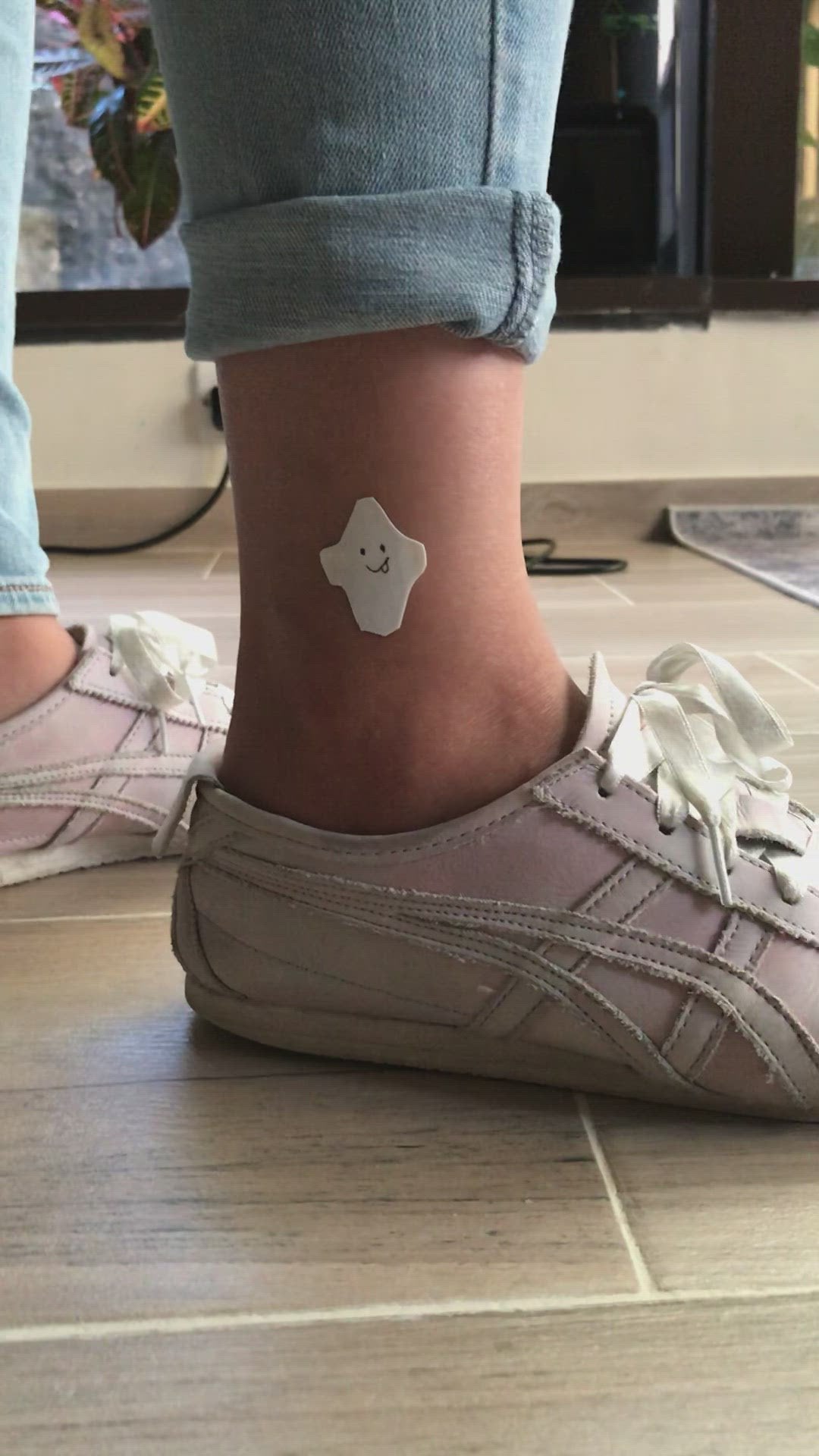 fake small halloween ghost minimalist temporary tattoo sticker design idea on leg ankle